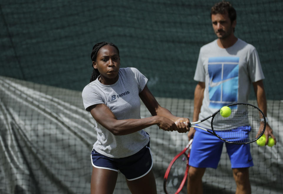 United States' Cori Gauff plays a practice session ahead of the Wimbledon Tennis Championships in London Sunday, June 30, 2019. (AP Photo/Ben Curtis)