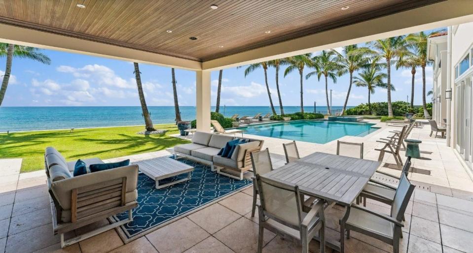 An oceanview loggia looks out to one of the two swimming pools at 1400 S. Ocean Blvd. in Manalapan near Palm Beach. The estate is priced at about $65 million.