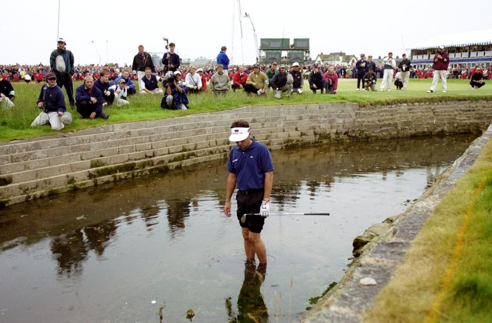 18 Jul 1999:  Jean Van De Velde of France looks at his ball in the burn on the 18th hole during the British Open played at the Carnoustie GC in Carnoustie, Scotland. \ Mandatory Credit: Ross Kinnaird /Allsport