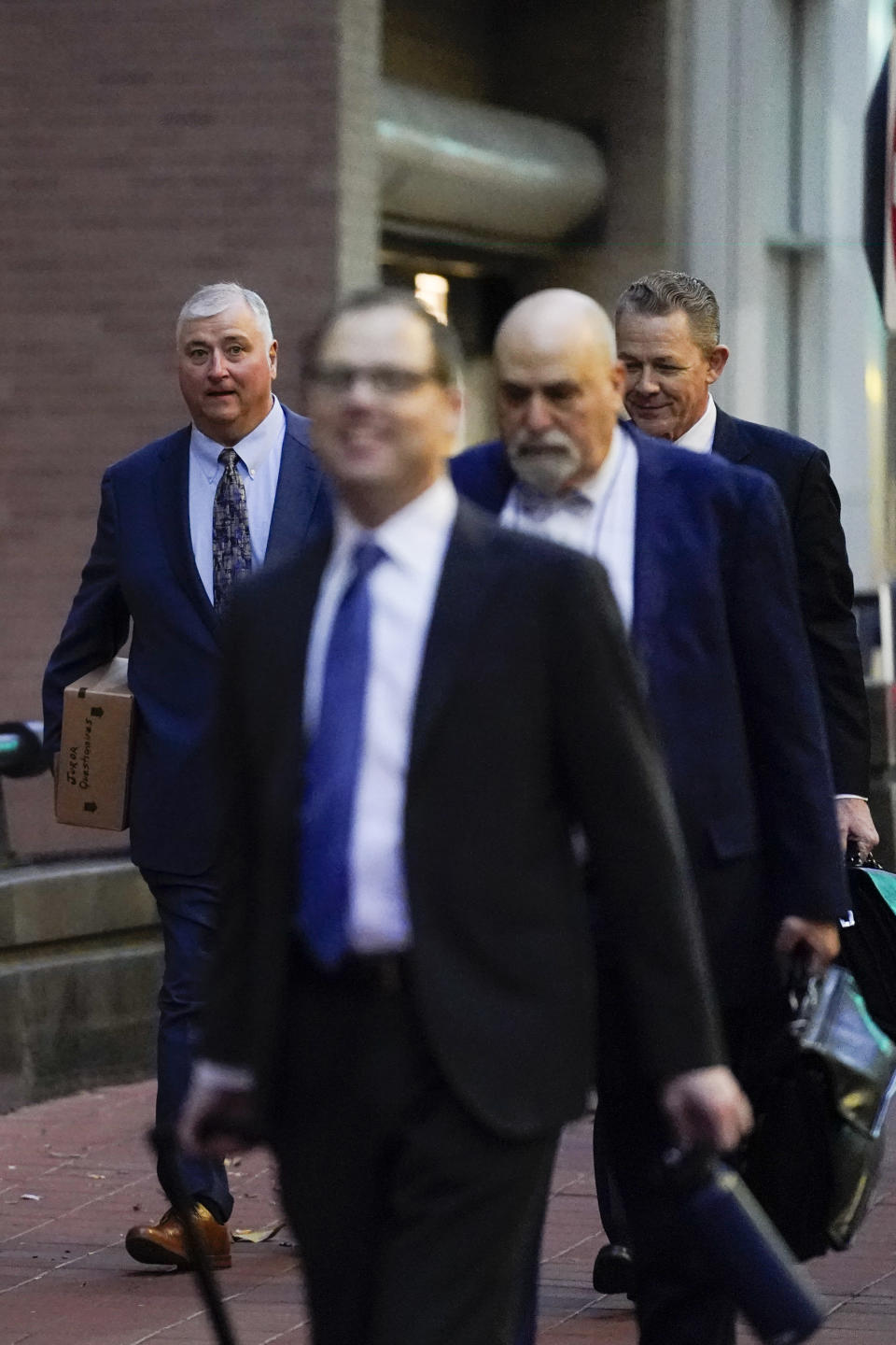 CORRECTS THAT PLANTS ARE FORMERLY OWNED BY FIRSTENERGY - Former Ohio House Speaker Larry Householder, left, walks toward Potter Stewart U.S. Courthouse with his defense team before jury selection in his federal trial, Friday, Jan. 20, 2023, in Cincinnati. Householder and former Ohio Republican Party chair Matt Borges are charged with racketeering in an alleged $60 million scheme to pass state legislation to secure a $1 billion bailout for two nuclear power plantsformerlyowned by Akron, Ohio-based FirstEnergy. Householder and Borges have both pleaded not guilty. (AP Photo/Joshua A. Bickel)