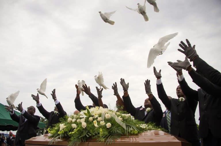 Pallbearer release doves over the casket holding Emanuel AME Church shooting victim Ethel Lance during her burial at the Emanuel AME Church Cemetery in Charleston, South Carolina, June 25, 2015