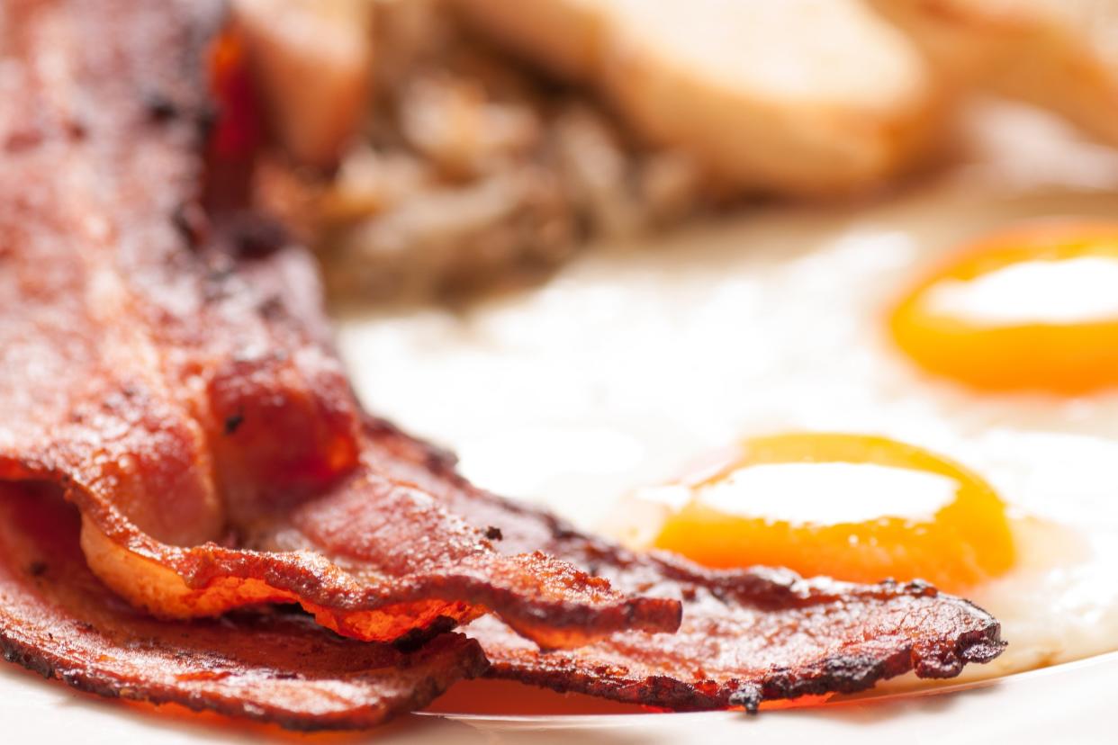 sunny side up eggs with organic bacon, hashbrowns, and crispy toast