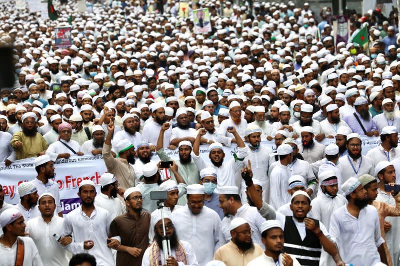 Muslims take part in a protest in Dhaka