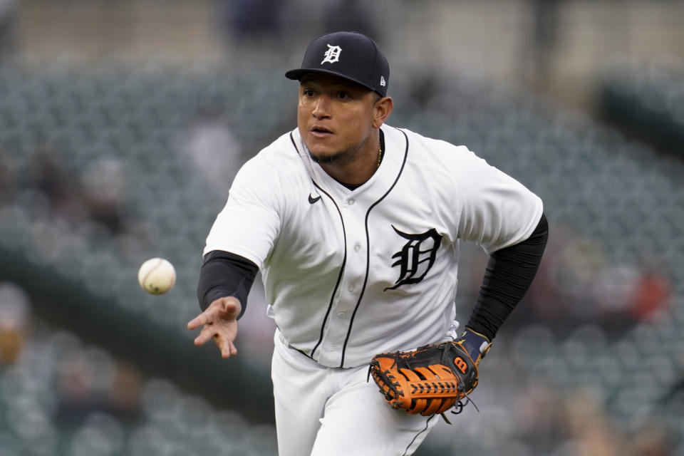 Detroit Tigers first baseman Miguel Cabrera tosses the ball to first base for an out against the Minnesota Twins in the third inning of a baseball game in Detroit, Friday, May 7, 2021. (AP Photo/Paul Sancya)