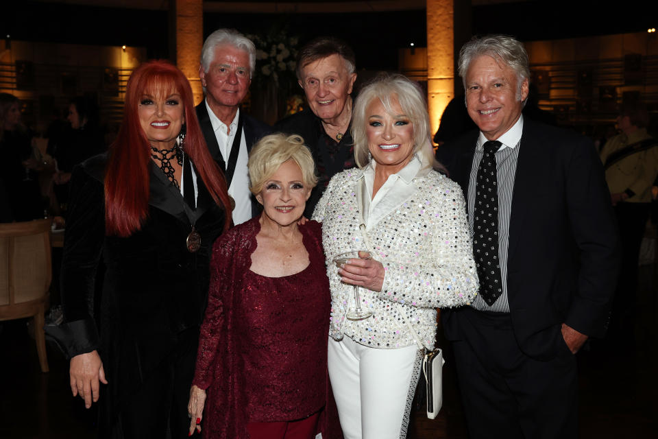 Wynonna Judd stands with Larry Strickland, Brenda Lee, Bill Anderson, Tanya Tucker and Craig Dillingham at awards show