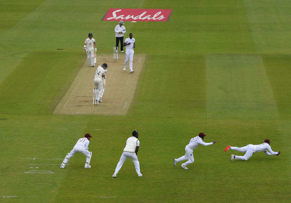 England's Joe Denly, center, bats during the first day of the 1st cricket Test match between England and West Indies, at the Ageas Bowl in Southampton, England, Wednesday July 8, 2020. (Mike Hewitt/Pool via AP)