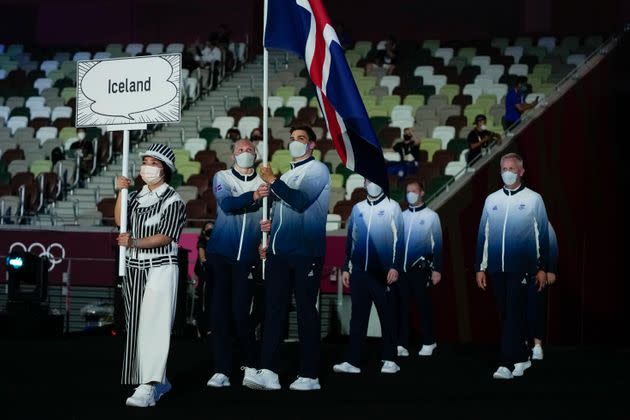 Snaefridur Sol Jorunnardottir and Anton Mckee, of Iceland, carry their country's flag during the opening ceremony. (Photo: Natacha Pisarenko via AP)