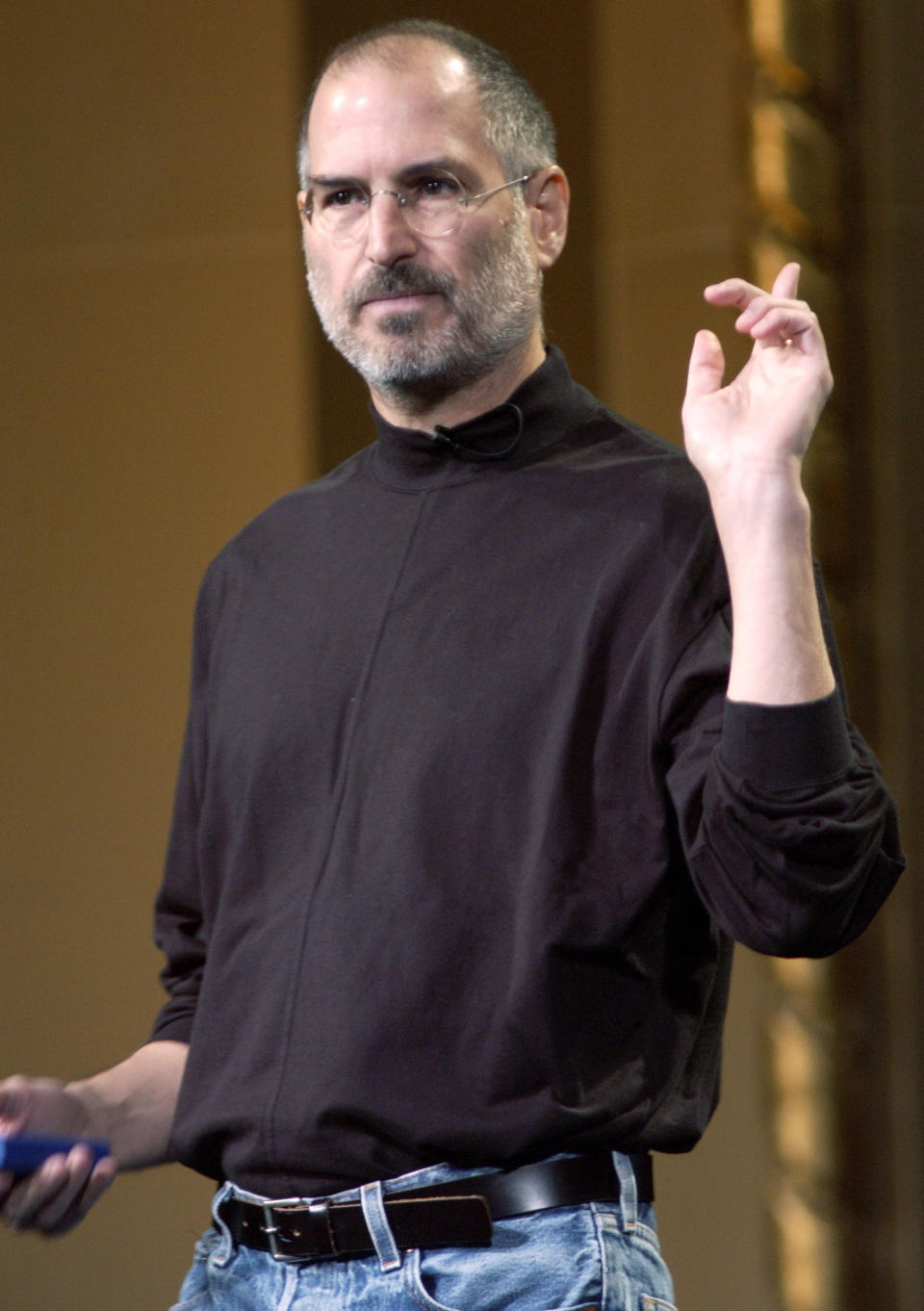 Steve Jobs shows off his uniform during a presentation. - Credit: Getty