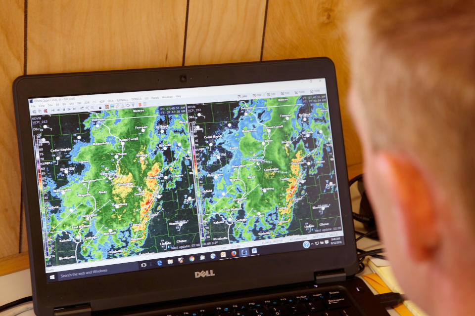 A Schneider Electric Meteorologist analyzes the latest forecast/Getty Images
