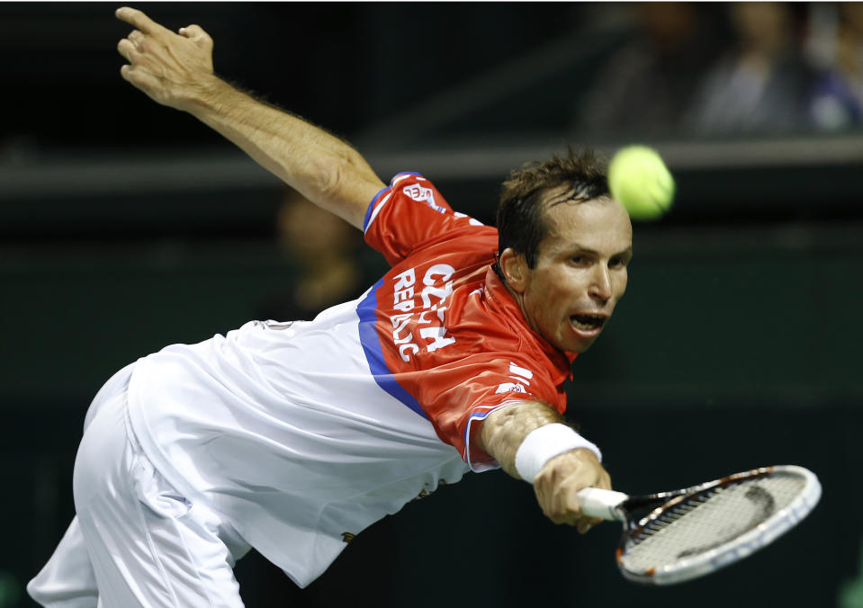 Radek Stepanek of the Czech Republic returns a shot to Tatsuma Ito of Japan during their quarterfinal of Davis Cup World Group tennis at Ariake Colosseum in Tokyo, Friday, April 4, 2014. (AP Photo/Shizuo Kambayashi)