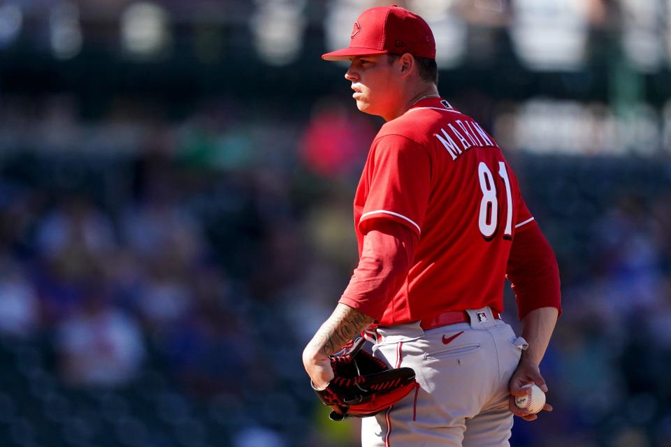 Cincinnati Reds pitcher James Marinan, (81) gets set to deliver during a spring training game against the Chicago Cubs, Monday, March 21, 2022, at Sloan Park in Mesa, Ariz.