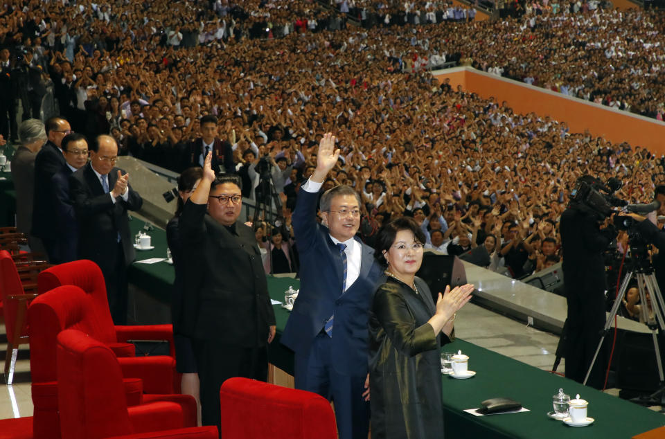 South Korean President Moon Jae-in and North Korean leader Kim Jong Un greet to Pyongyang citizens after watching the mass games performance of "The Glorious Country" at May Day Stadium in Pyongyang, North Korea, Wednesday, Sept. 19, 2018. (Pyongyang Press Corps Pool via AP)