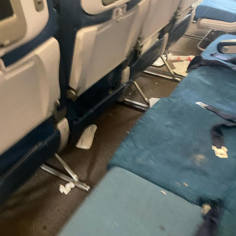 This mobile photo courtesy of passenger Jazmin Bitanga shows the interior of a Hawaiian Airlines plane on its flight from Phoenix to Honolulu, Sunday, Dec. 18, 2022, after severe turbulence rocked the flight. (Courtesy of Jazmin Bitanga via AP)