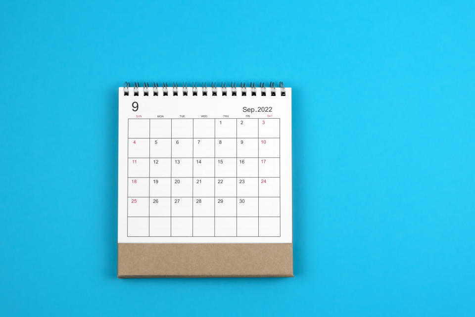 Image of calendar on blue background. (Getty Images)