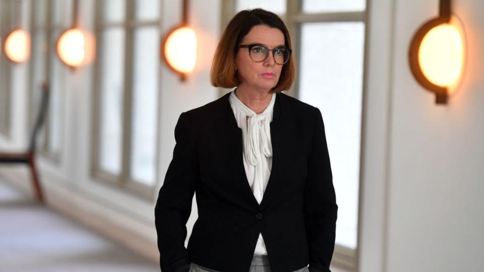 Women's Safety Minister Anne Ruston walks through the halls of Australian Parliament House. 