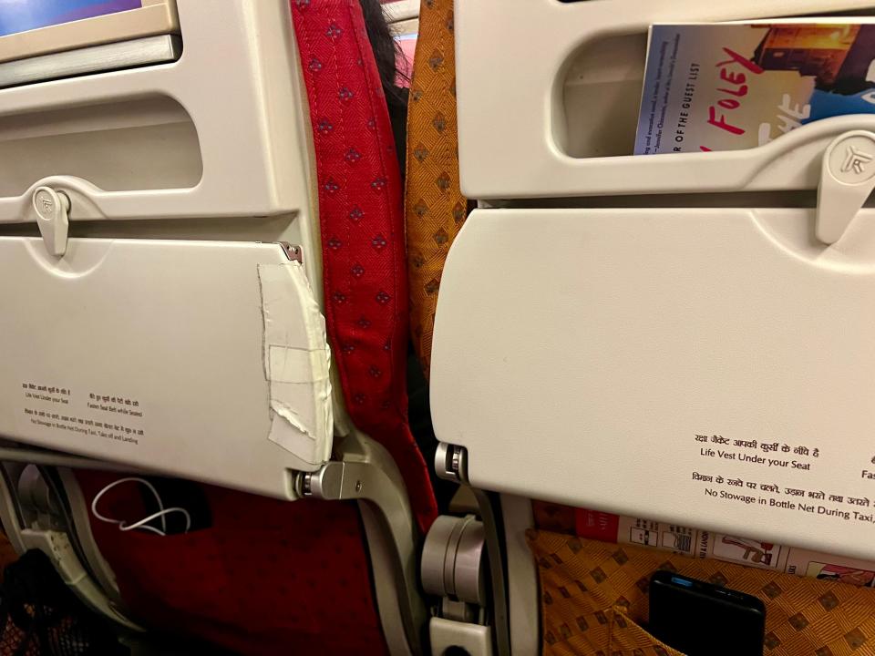 The tray table next to me was patched with tape.