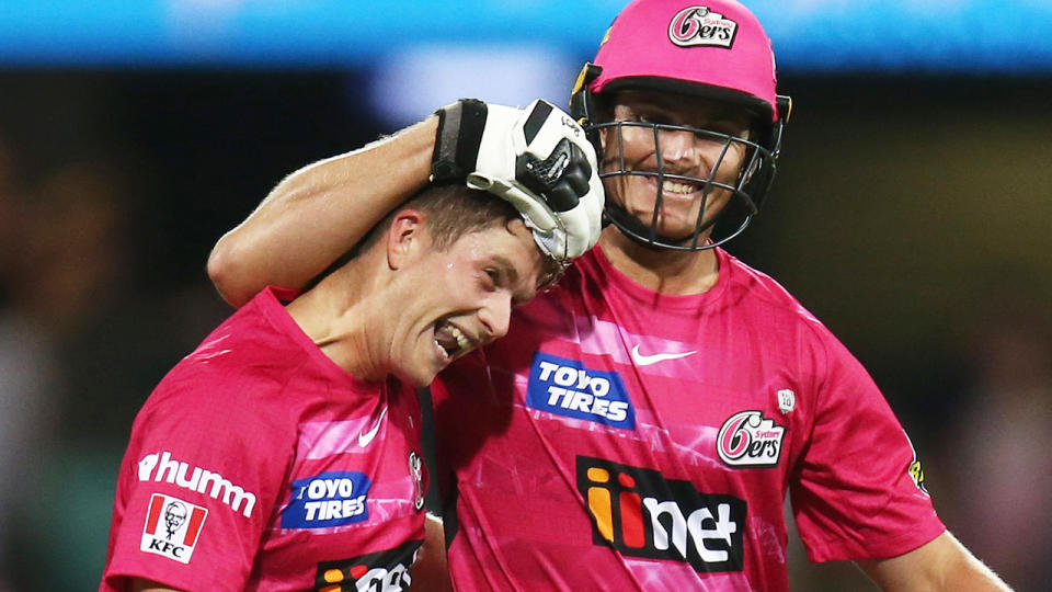 Sydney Sixers' Jay Lenton, right, feared he had donned too much gear when he was called on to act as a runner in Thursday night's BBL final. (Photo by Jason McCawley - CA/Cricket Australia via Getty Images)