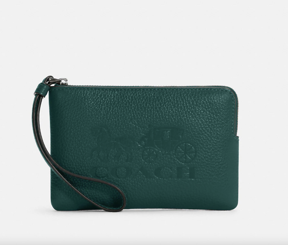 Corner Zip Wristlet with Horse and Carriage in green (Photo via Coach Outlet)