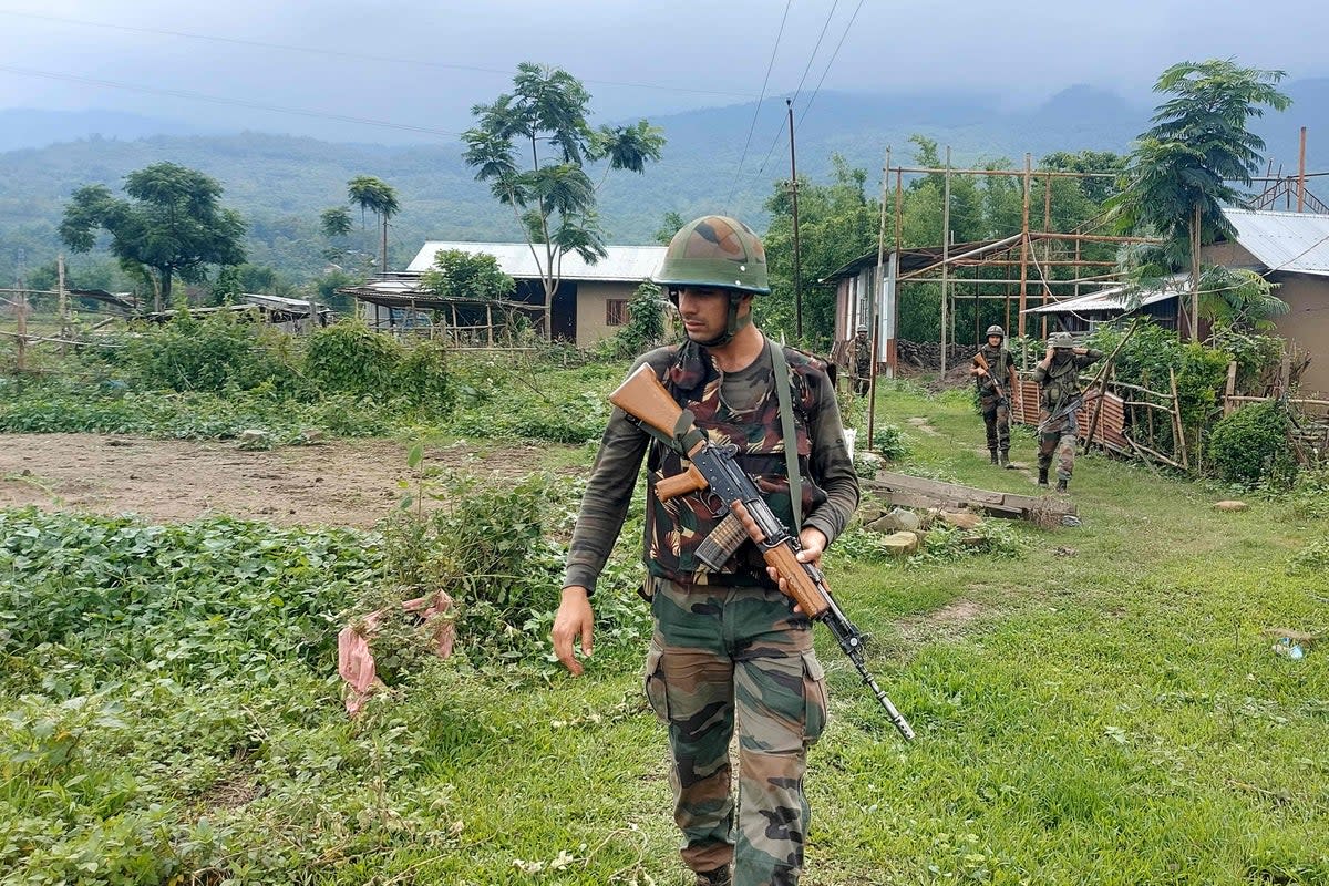 Indian Army personnel patrol during a combing operation at Kanto Sabal village near Imphal (AFP via Getty Images)