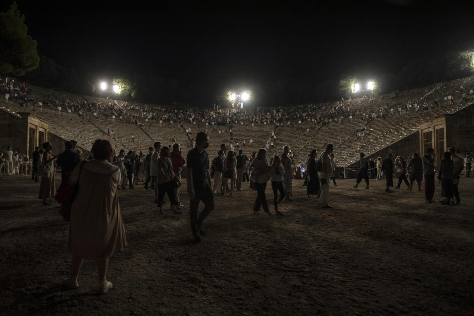 Spectators leave the ancient theater of Epidaurus, after a concert, on Friday, July 17, 2020. Live concerts and events have been mostly canceled in Greece this summer due to pandemic concerns. But the Culture Ministry allowed the ancient theaters of Epidaurus in southern Greece and Herodes Atticus in Athens to host performances under strict safety guidelines. AP Photo/Petros Giannakouris)