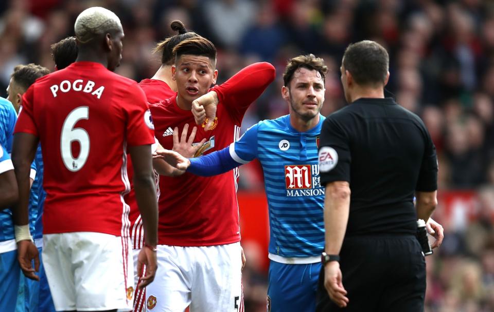 Marcos Rojo reminds referee Kevin Friend there was an elbow in there - not realising it was his own team mate's 