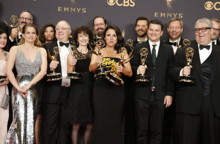 69th Primetime Emmy Awards – Photo Room – Los Angeles, California, U.S., 17/09/2017 - Julia Louis-Dreyfus is joined by the cast and crew of Veep as she holds her Emmys for Outstanding Lead Actress in a Comedy Series and Outstanding Comedy Series. REUTERS/Lucy Nicholson