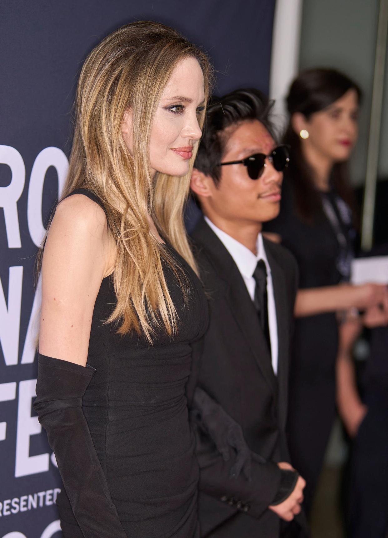 US director Angelina Jolie and her son Pax Jolie-Pitt attend the world premiere of "Without Blood" at TIFF Lightbox theatre during the Toronto International Film Festival on Sept. 8, 2024.