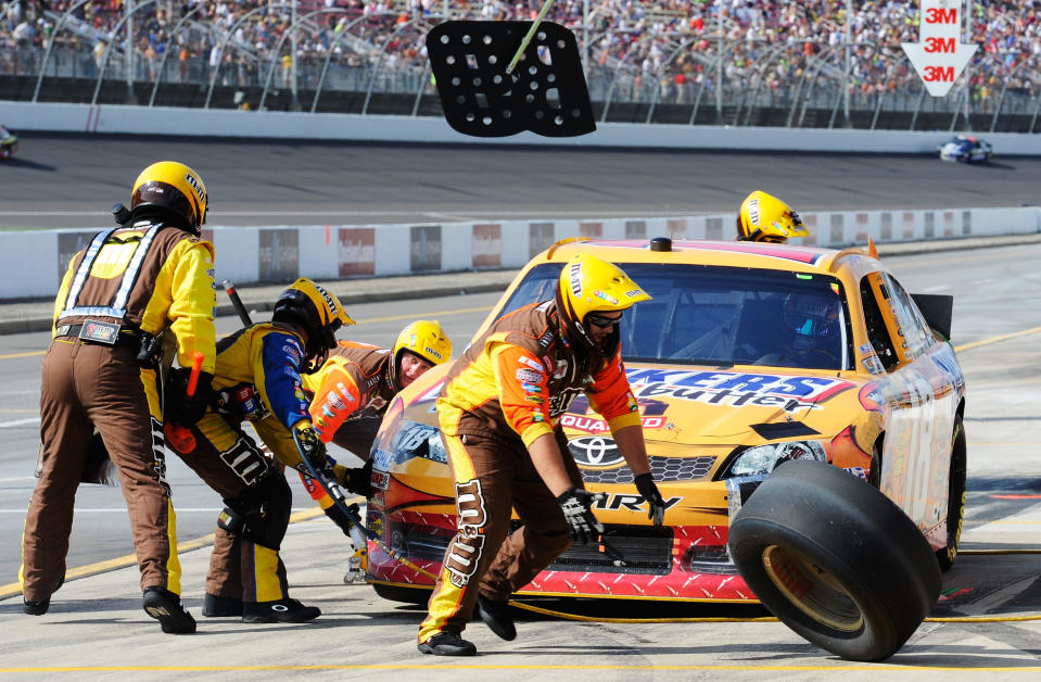 BROOKLYN, MI - JUNE 17: Kyle Busch, driver of the #18 Snickers Toyota, pits during the NASCAR Sprint Cup Series Quicken Loans 400 at Michigan International Speedway on June 17, 2012 in Brooklyn, Michigan. (Photo by John Harrelson/Getty Images for NASCAR)