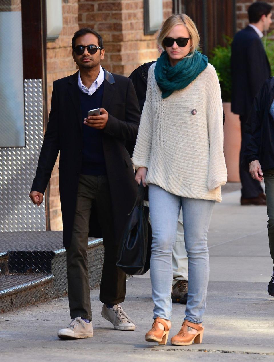 <p>Aziz Ansari: 5' 6"<br>Courtney McBroom: 5' 7"<br></p>