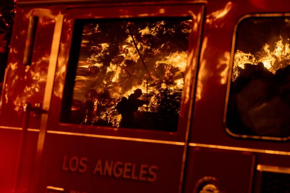 <div class="inline-image__caption"><p>Flames are reflected on a LA City fire truck on Sepulveda Blvd. in the Sepulveda Pass as the Getty fire as it burns in Los Angeles, Calif., on Oct. 28, 2019. </p></div> <div class="inline-image__credit">Brian van der Brug/Los Angeles Times via Getty</div>