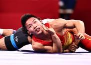 <p>CHIBA, JAPAN - AUGUST 04: Gulomjon Abdullaev of Uzbekistan competes against Liu Minghu of China during the Men's Freestyle 57kg 1/8 Final on day twelve of the Tokyo 2020 Olympic Games at Makuhari Messe Hall on August 4, 2021 in Chiba, Japan. (Photo by Wang Xianmin/CHINASPORTS/VCG via Getty Images)</p> 