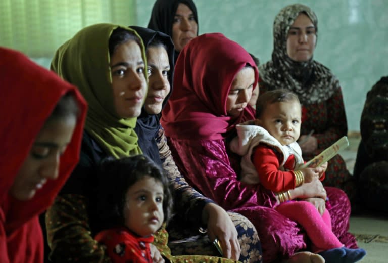 Women and girls in the Iraqi Kurdish village of Sharboty Saghira listen to a talk about the dangers of genital mutilation, on December 3, 2018