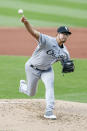 Chicago White Sox starting pitcher Dane Dunning delivers against the Cleveland Indians during the first inning of a baseball game, Monday, Sept. 21, 2020, in Cleveland. (AP Photo/Ron Schwane)