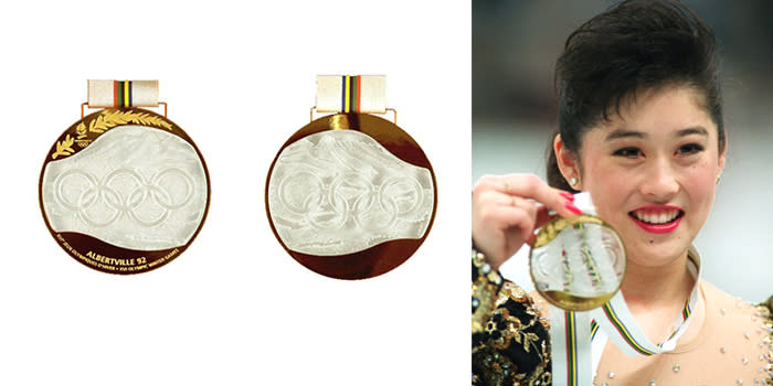 <p>Medals for the 1992 Winter Olympics in Albertville, France, were made with Lalique glass, set in gold, silver, and bronze, and completely hand-made.<br> (IOC photo; US gold medalist for Women’s Figure Skating, Kristi Yamaguchi/photo by Junji Kurokawa/AFP/Getty Images) </p>