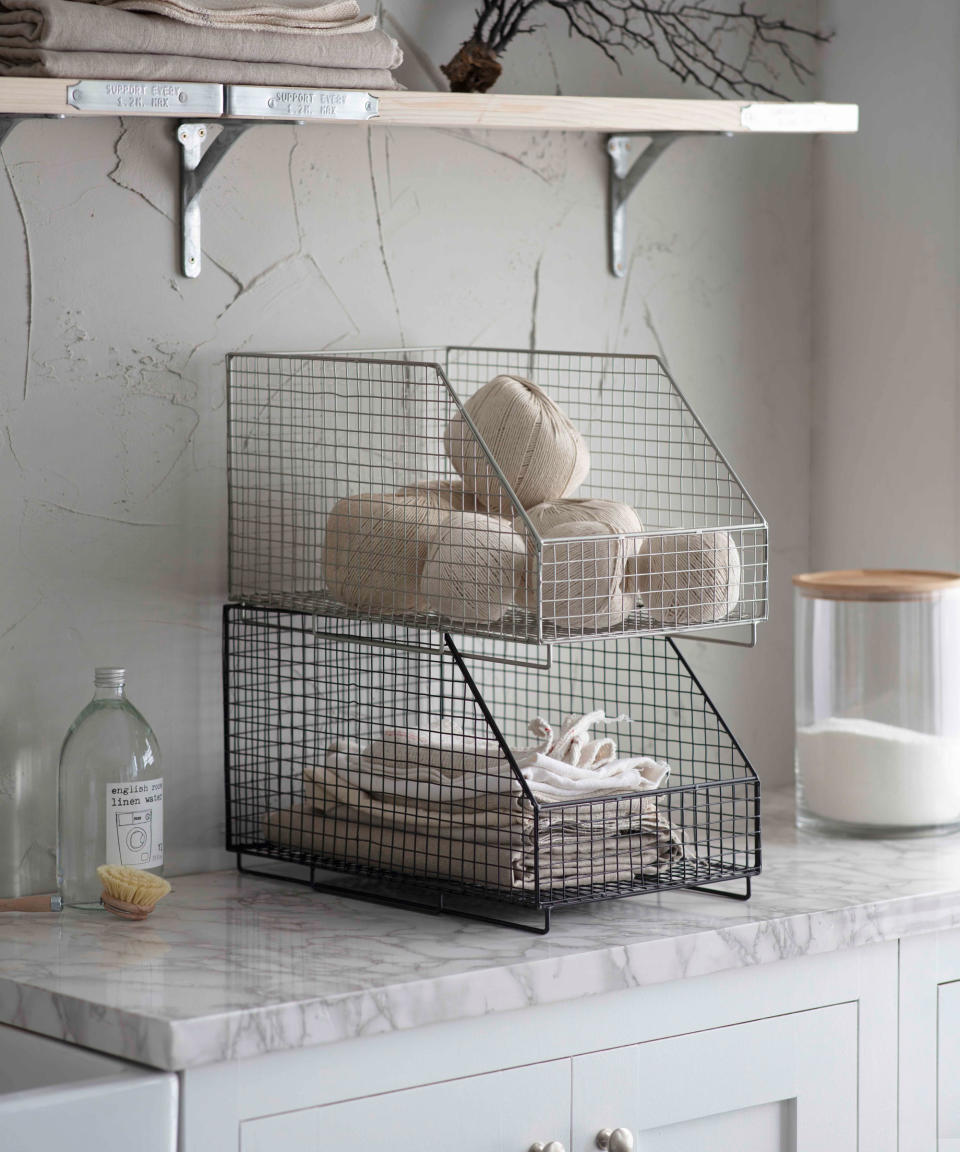 20. Use baskets and boxes to hide laundry room clutter