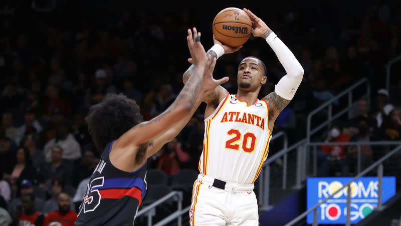 Atlanta Hawks forward John Collins shoots over Detroit Pistons forward Marvin Bagley III, left, during the first half of an NBA basketball game Tuesday, March 21, 2023, in Atlanta. 