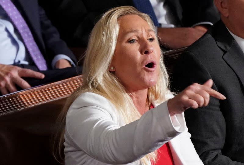 FILE PHOTO: U.S. Rep. Marjorie Taylor Greene yells out as House of Representatives elect Mike Johnson as the new Speaker of the House at the U.S. Capitol in Washington