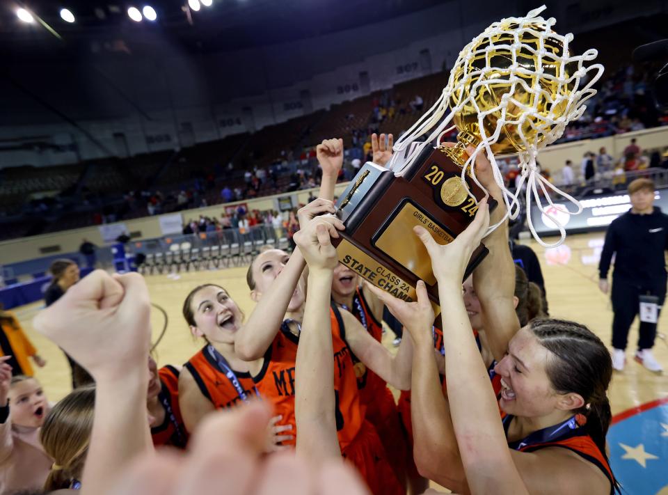 Merritt celebrates the class 2A girls state championship over Dale at the State Fair Arena in Oklahoma City, Saturday, March 9, 2024.
