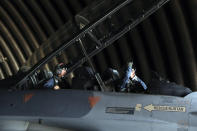 Turkey's Defense Minister Hulusi Akar, left, sits inside an F-16 jet fighter at a military air base in western city of Eskisehir, Turkey, Wednesday, Sep. 2, 2020, before a training flight over Turkish Monument in Gallipoli peninsula. Akar said Thursday that Washington's lifting the arms embargo against Greek Cypriot-administered Cyprus will lead to a deadlock. "If you lift the embargo and try to disrupt the balance in this way, this will bring conflict, not peace," he said.(Turkish Defense Ministry via AP, Pool)