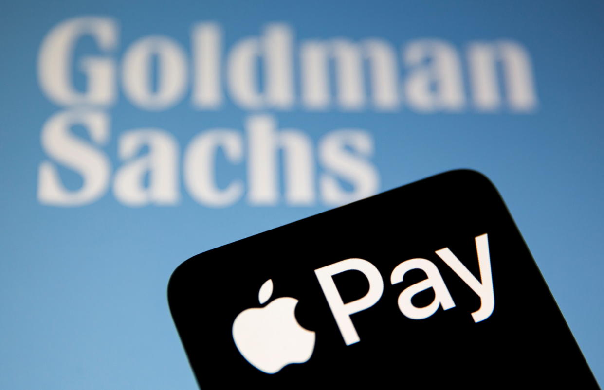 A smartphone with the Apple Pay logo is placed on a displayed Goldman Sachs logo, in this illustration taken on July 14, 2021. REUTERS/Dado Ruvic/Illustration