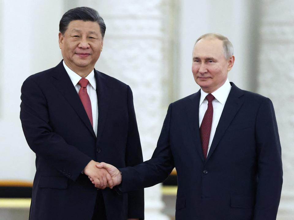 Russian President Vladimir Putin shakes hands with Chinese President Xi Jinping during a welcome ceremony before Russia - China talks in narrow format at the Kremlin in Moscow, Russia March 21, 2023.