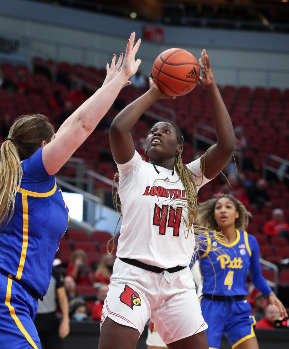 U of L's Olivia Cochran (44) shoots against the Pitt defense during their game at the Yum Center in Louisville, Ky. on Jan. 6, 2022.  U of L won 81-39.