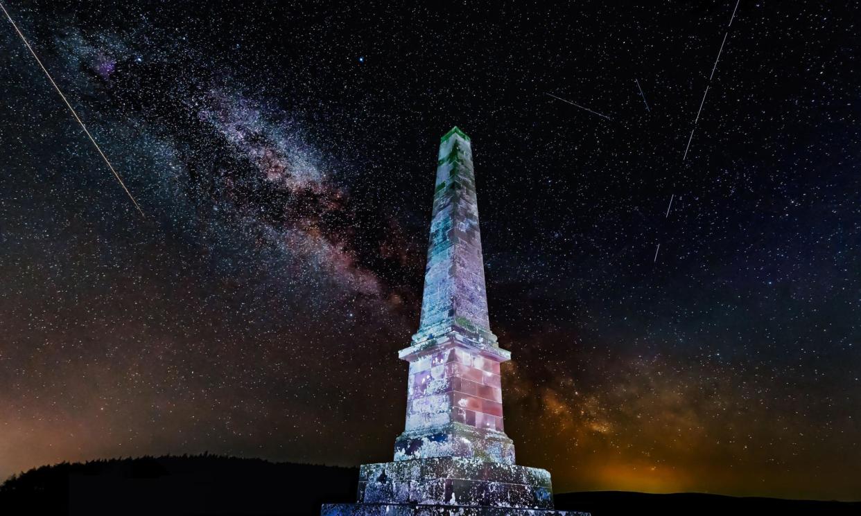 <span>The Balfour monument lit up at night with the Milky Way visible in the sky above in East Lothian, Scotland.</span><span>Photograph: Sally Anderson/Alamy</span>