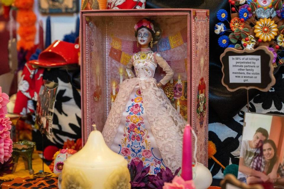 A Dia de los Muertos-themed Barbie doll stands on in altar at the Mattie Rhodes Center.