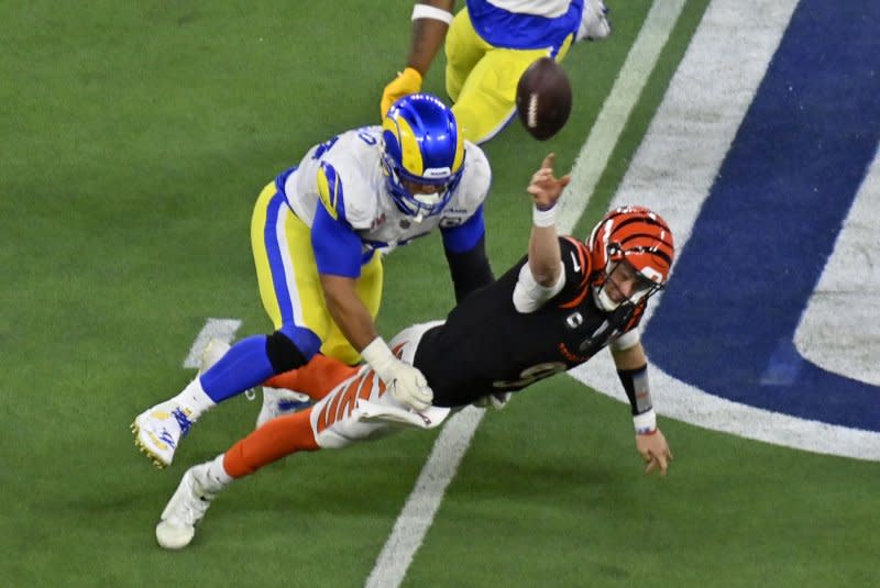 Cincinnati Bengals quarterback Joe Burrow (R), who is hobbled by a calf injury, could face defensive tackle Aaron Donald and the Los Angeles Rams on Monday in Cincinnati. File Photo by Jim Ruymen/UPI