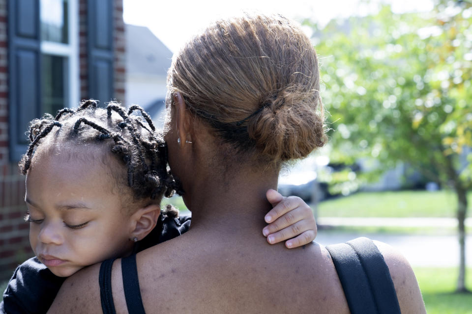 Aaliyah Wright, 25, of Washington, carries her son Khaza Wright, 1, to visit his grandmother in Accokeek, Md., Tuesday, Aug. 9, 2022. A landmark social program is being pioneered in the nation’s capital. Coined “Baby Bonds,” the program is designed to narrow the wealth gap. The program would provide children of the city’s poorest families up to $25,000 when they reach adulthood. (AP Photo/Jacquelyn Martin)