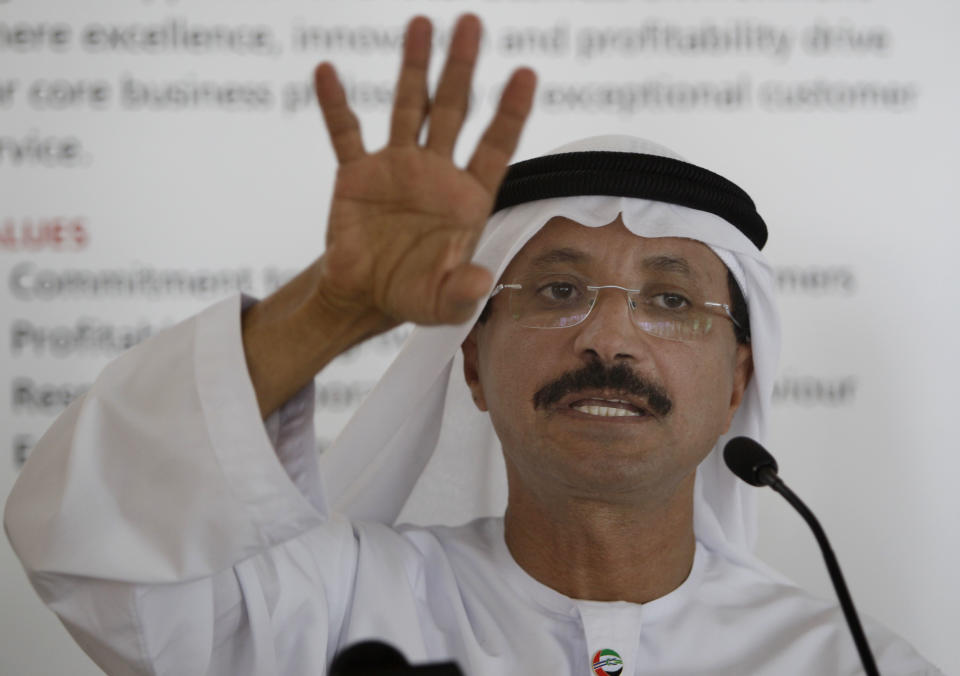 Istithmar World Chairman, Sultan Ahmed bin Sulayem, talks to journalists about the future plans for the Queen Elizabeth 2 announcing the decision to turn the retired cruise liner into a 300-room hotel, ending years of speculation about its fate, in Port Rashid, Dubai, United Arab Emirates, Monday, July 2, 2012. Britain's Queen Elizabeth II launched the QE2 in 1967. (AP Photo/Kamran Jebreili)