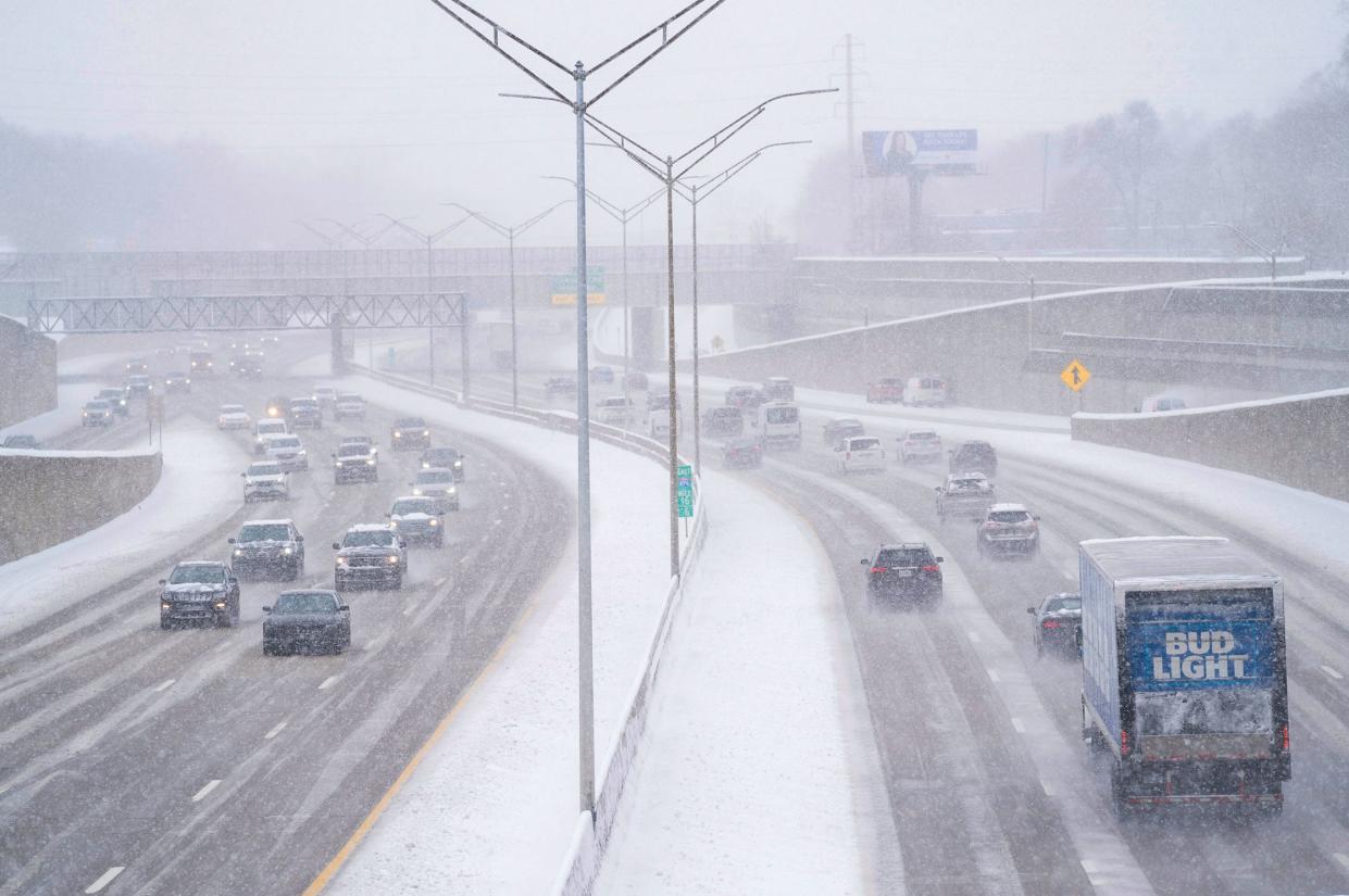 A sloppy commute for drivers on 696 in Royal Oak during a snow storm that hit Metro Detroit on Friday, March 22, 2024.