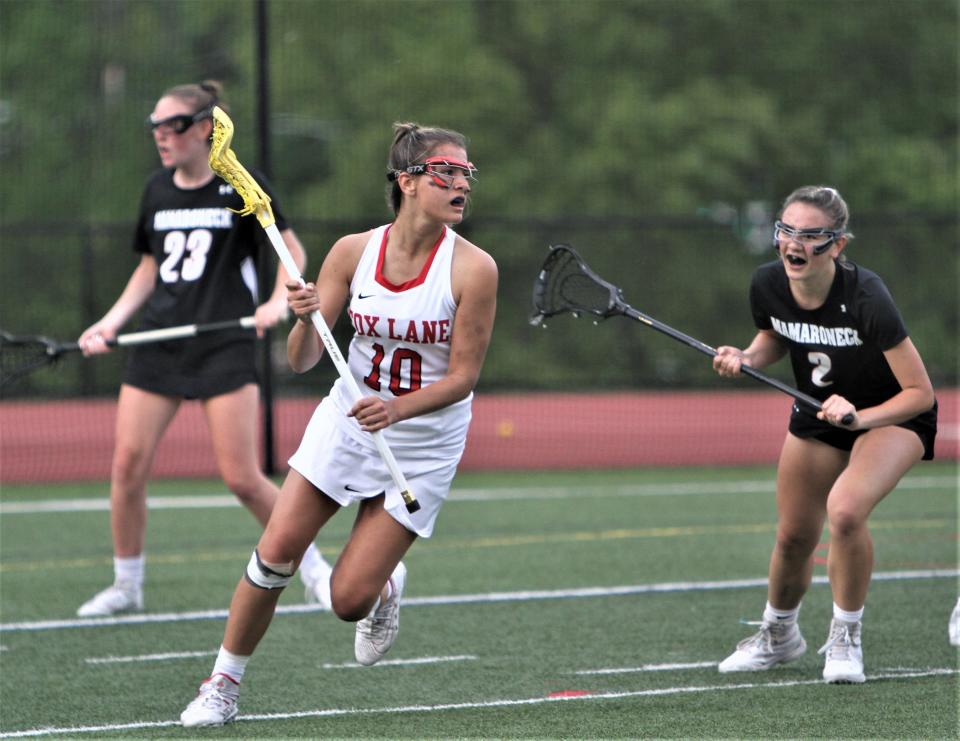 Fox Lane freshman Zoe Stonecipher (10) who had three first-half goals, carries the ball during the Foxes' 10-8 Section 1 Class A girls lacrosse semifinal loss to Mamaroneck May 23, 2022 at Fox Lane.