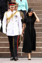 <p>Prince Harry was dressed in full military uniform, while Meghan wore a stunning black dress by New Zealand designer <a rel="nofollow noopener" href="https://www.matchesfashion.com/au/products/1221217?rffrid=sem.Google.n=g.cid=919463167.aid=50012969470.k=.mty=.d=c.adp=1o1.cr=218724004203.tid=aud-428184845686:pla-349688439582.pid=1221217000008.ppid=349688439582.lpm=9071790.adty=pla.prl=en&utm_content=1221217000008&utm_term=349688439582.[value].&gclid=EAIaIQobChMInrHnovaT3gIVBAUqCh1oIwp0EAYYASABEgLesvD_BwE&gclsrc=aw.ds" target="_blank" data-ylk="slk:Emilia Wickstead which retails for $2,600;elm:context_link;itc:0;sec:content-canvas" class="link ">Emilia Wickstead which retails for $2,600</a>. Source: Getty </p>